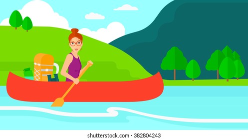 Woman canoeing on the river.