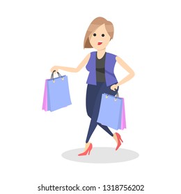 Woman carrying shopping bags with purchases