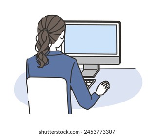 A woman in casual office wear working on a computer