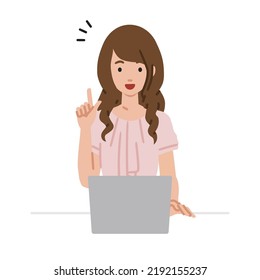 a woman in casual work style using laptop computer getting ideas with pointing hand gesture at her desk