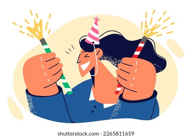 Woman celebrating birthday smiling raising hands with fireworks enjoying birthday party for friends and family. Girl in party hat has fun and fires firecrackers during birthday hangout 
