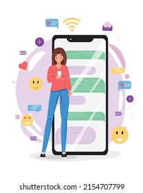 Woman with a cell phone. Woman texting from the cell phone. Young woman standing next to the big smartphone and using own smartphone with social media elements and emoji icons on the background. 