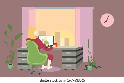 a woman in chair at the table is negotiating a video call against the sunset in the window. later time for remote work