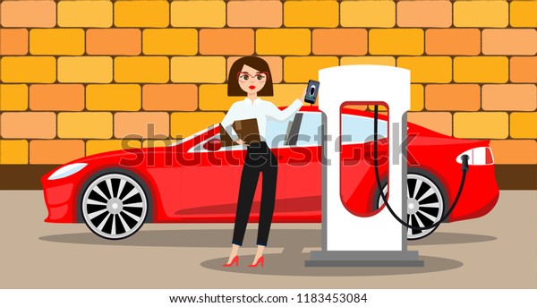 Woman charges an electric car at a charging\
station for electric\
vehicles.