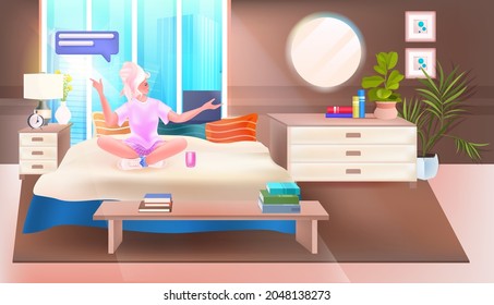 woman with chat bubble speech online communication concept bedroom interior full length horizontal