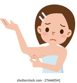 Woman is checking her triceps and seems to be unpleased 