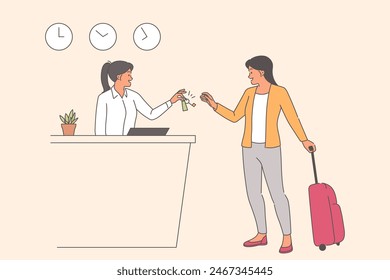 Woman checks into hotel and holds suitcase with luggage taking keys from receptionist during business trip. Girl hotel manager serves client with smile, standing near riser with clock.