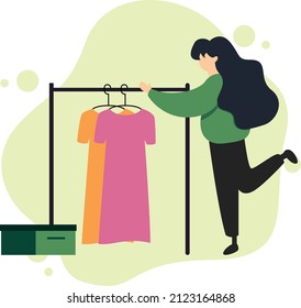 Woman choosing clothes in the shop