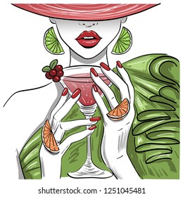 woman with citrus martini cocktail in hat