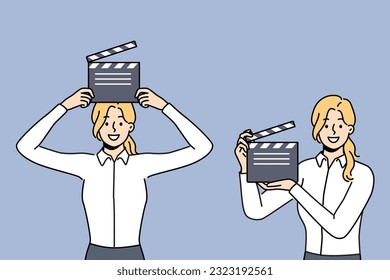 Woman with clapboard for shooting movie works in hollywood film company and dreams of becoming film director. Girl with clapboard to help filming blockbuster demonstrates equipment for recording takes