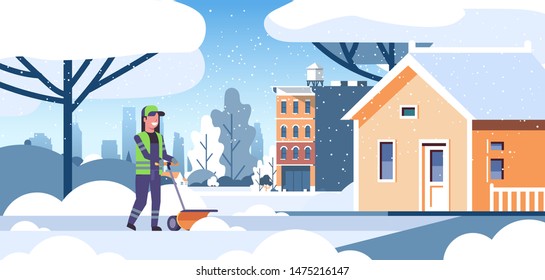 woman cleaner in uniform using handle snowplough snow removal service concept female worker cleaning residential house area flat full length