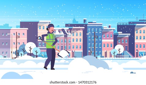 woman cleaner using plastic shovel snow removal concept female worker in uniform cleaning residential area modern city buildings cityscape background flat horizontal full length