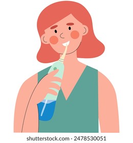 Woman is cleaning teeth by  oral irrigator or water flosser.  Dental care and hygiene concept.