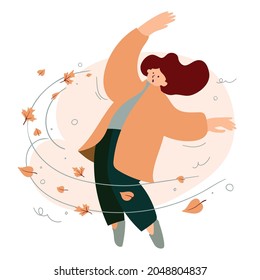 Woman in coat and strong gust of autumn wind with leaves