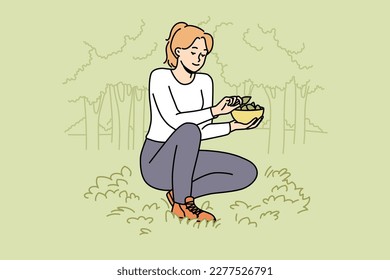 Woman collecting leaves in forest. Happy female gathering plants in wood, putting leaf in basket. Vector illustration. 