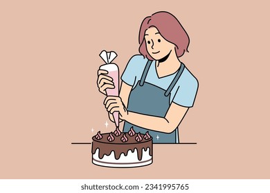 Woman confectioner prepares delicious cake for birthday party and decorates dessert with chocolate and butter cream. Young girl uses pastry bag to prepare sweet cake for festive table.