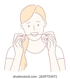 A woman confidently demonstrating the proper dental flossing technique for maintaining healthy oral hygiene