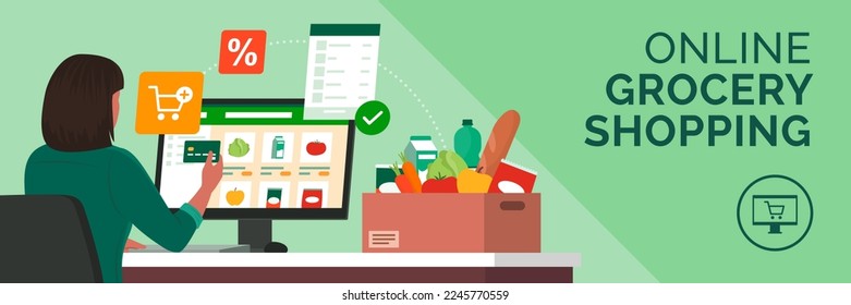 Woman connecting with her computer and doing grocery shopping online, she is paying with a credit card