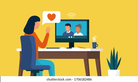 Woman connecting with her computer at home and videocalling her family, relationships and communication concept