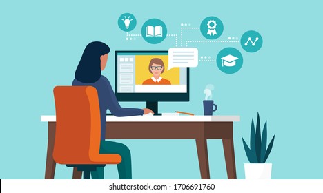 Woman connecting with her computer at home and following online courses, distance learning concept