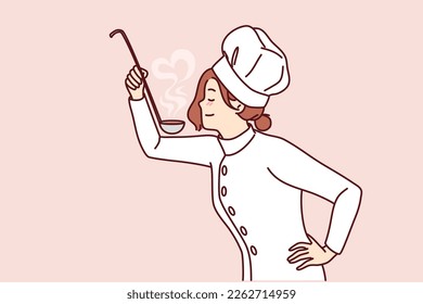 Woman cook with ladle in hand tries soup or sauce from menu preparing dish for restaurant guests. Girl in uniform and cook chef hat cooks food enjoying favorite job in cafe or diner 