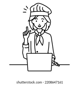 a woman cook using laptop computer getting ideas with pointing hand gesture at her desk