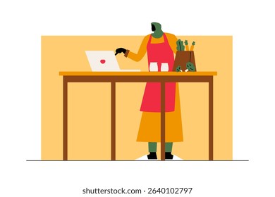 A woman cooking in the kitchen after finishing remote work
