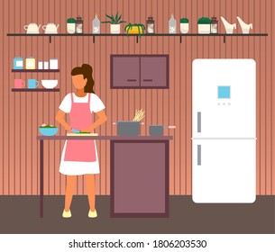 Woman cooking at kitchen. Female cutting salad at wooden board with knife. Bowl with salad, pan with raw spaghetti at kitchen table. Woman prepare food at home. Shelves with decoration at wall, fridge