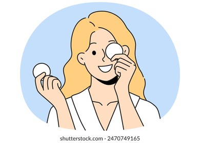 Woman with cotton pads for removing makeup and mascara with lipstick smiling getting ready for bed. Beautiful girl uses cotton pads for cosmetic purposes, wanting to impress boyfriend