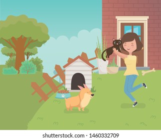 woman with cute little cat and dog in the house garden