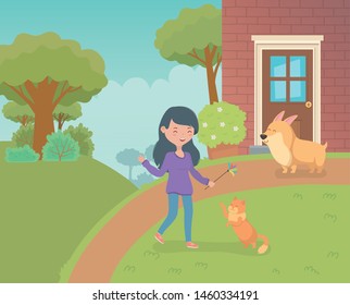 woman with cute little cat and dog in the house garden