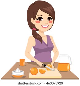 woman cutting oranges with knife preparing healthy organic juice