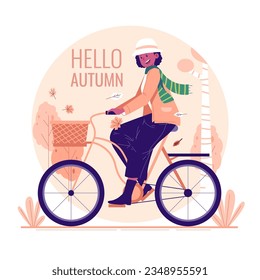 A woman cycling in the park in autumn