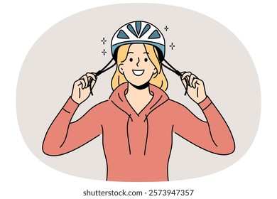 Woman cyclist puts protective helmet on head before cycling to protect against injuries from falls. Girl lover cycling advocates use of hardhat to avoid accidents that could lead to hospitalization.