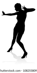 A woman dancer dancing in silhouette