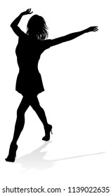 A woman dancer dancing in silhouette