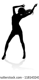 A woman dancer dancing in silhouette