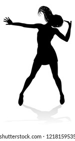 A woman dancer dancing in silhouette