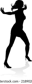 A woman dancer dancing in silhouette