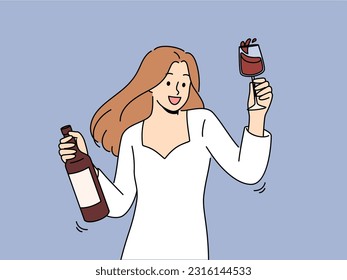 Woman dances at party holding bottle of wine and glass filled with exquisite alcoholic drink. Girl in white dress for party is addicted to alcohol and rejoices at new opportunity to drink