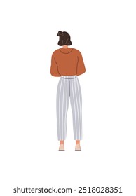 A woman with dark hair tied in a bun, wearing a brown sweater, gray and white striped pants, and flat shoes stands with her back facing the viewer. Ideal for fashion design, casual attire