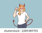 Woman demon with horns and tail points her finger at screen and looks at you aggressively. Evil demon girl threatens or tries to solve problems that have arisen with help of violence and aggression 