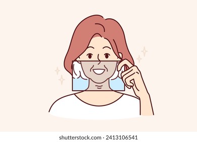 Woman demonstrates snow-white smile by applying glass to face and presenting result after whitening procedure at dentist. Young girl with beautiful smile represents own image in old age