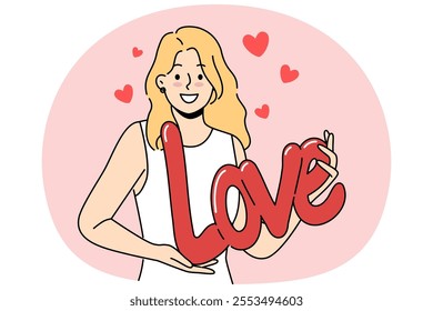 Woman demonstrates word love form of balloon, congratulating you on Valentine day or february 14th. Romantic girl confesses love to boyfriend and looks at screen smiling, offering to become couple