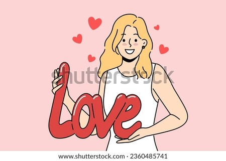 Woman demonstrates word love form of balloon, congratulating you on Valentine day or february 14th. Romantic girl confesses love to boyfriend and looks at screen smiling, offering to become couple