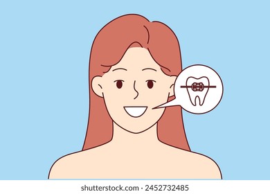 Woman with dental braces shows beautiful smile obtained thanks to trip to dentist or orthodontist. Girl recommends using dental braces and regularly visiting dentist clinic for prevent problems.