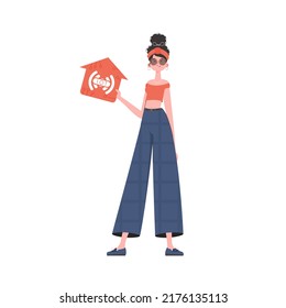 The woman is depicted in full growth, holding an icon of a house in her hands. IoT concept. Vector illustration in trendy flat style.