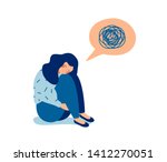 Woman in depression with bewildered thoughts in her mind. Young sad girl sitting and unhappy hugging her knees.