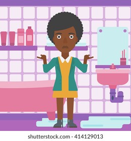 Woman in despair standing near leaking sink.