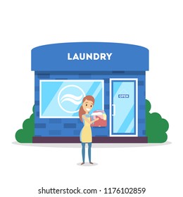 Woman with dirty clothes standing in front of laundry building. Laundry serice in the city. Isolated flat vector illustration